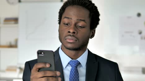 African-Businessman-Using-Smartphone