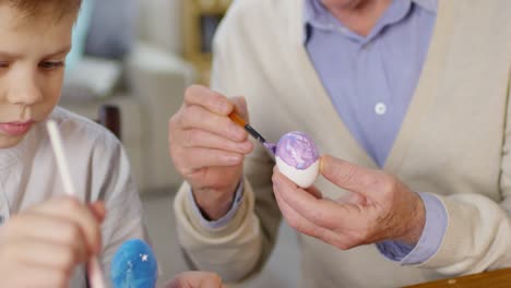 Boy-and-Grandfather-Decorating-Eggs-for-Easter