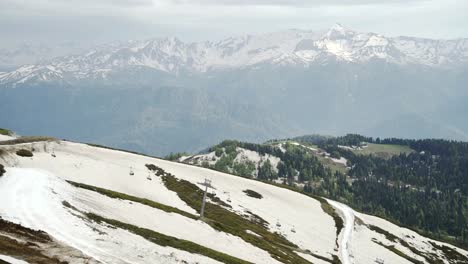 Snowy-mountains-in-spring.-Aerial-shot-of-ski-resort