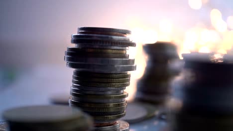 Double-exposure-of-city-view-and-rows-of-coins-for-finance-,-money-,-investment-and-business-concept-background