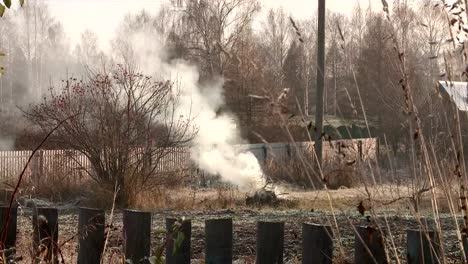 village-street-in-Russia-in-late-autumn-smoke-from-the-pipe