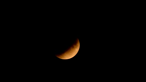 Partial-lunar-eclipse-of-the-full-moon-in-juli-2019-in-the-dark-night-sky