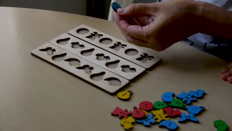 autistic-boy-arranges-objects-in-a-form