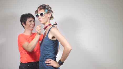 girlfriend-lesbian-puts-on-her-girlfriend-lesbian-choker-on-the-neck-for-a-party