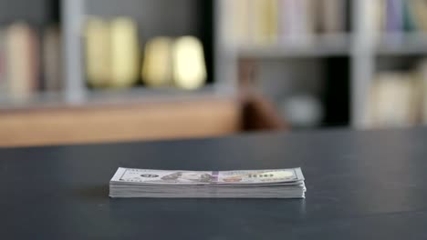 Close-Up-of-Money-on-Businessman-Office-Table