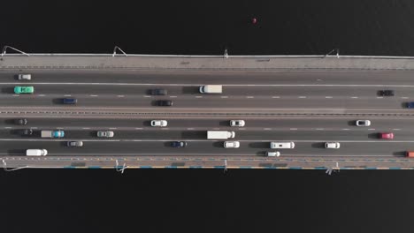 Bridge-highway-cars-traffic-aerial-top-view-tracking-shot