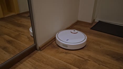 Robot-vacuum-cleaner-cleans-the-hallway