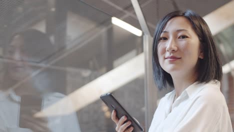 Portrait-of-Asian-Woman-with-Mobile-Phone