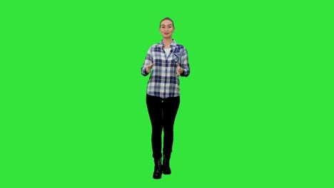 Happy-smiling-woman-in-casual-presenting-and-showing-something-on-a-Green-Screen,-Chroma-Key