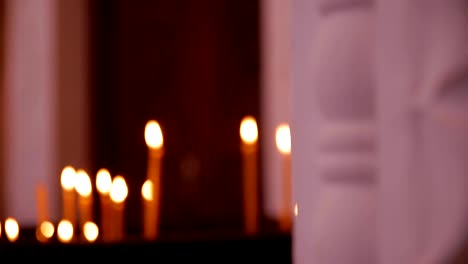 Inside-the-Orthodox-Church-Candles-Are-Burning-People-Come-to-Light-a-Candle-Icon-in-the-Church