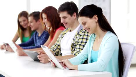 happy-students-with-tablet-pc-computers-learning-at-school