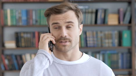 Portrait-of-Adult-Man-Talking-on-Phone