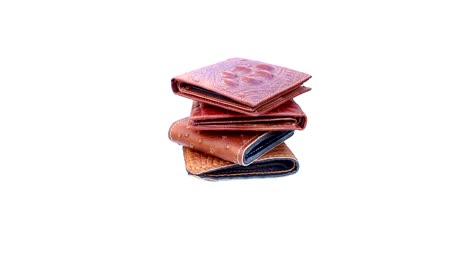 Group-wallet-of-leather-rotating-on-isolated