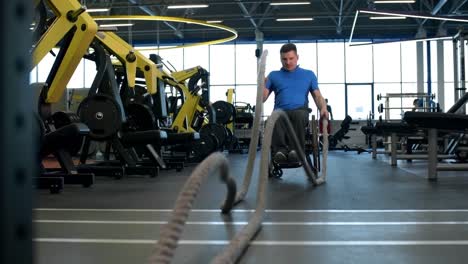 Sportsman-in-Wheelchair-Exercising-with-Battle-Ropes