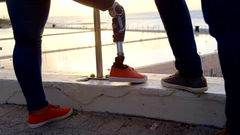 Low-section-of-couple-standing-at-promenade-near-railing-4k