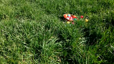 colorful-easter-eggs-in-the-fresh-spring-meadow,-aerial-view