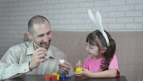 Easter-holiday.-Family-paints-eggs.