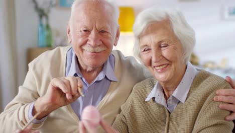 Portrait-of-Elderly-Couple-Preparing-for-Easter