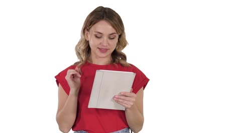 Smiling-woman-with-tablet-computer-presenting-turning-pages-on-white-background