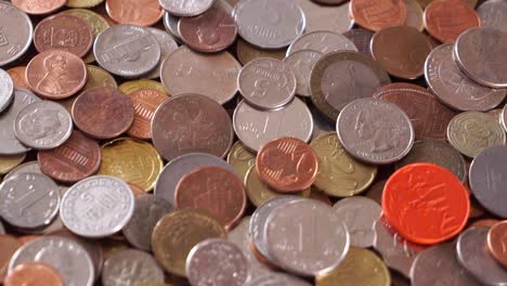 Many-different-coins-on-the-table.-Background-of-coins.