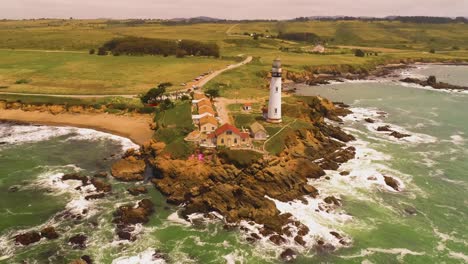 Light-House-Drone-Shot-Aerial-Helicopter-View-Ocean-Coast-Line-with-crashing-waves-sun-set-4K