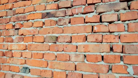 pared-de-ladrillo-rojo-y-piedra-con-ladrillo-viejo-dañado,-fondo-para-el-diseño