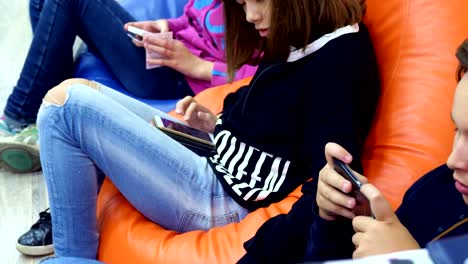 teenagers-children-use-gadgets,-smartphones,-chat-in-social-networks.-the-concept-of-children's-addiction-of-phones-and-tablets