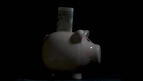 Piggy-bank-with-dollars.