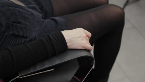 Beautiful-woman-hand-on-the-arm-of-a-chair