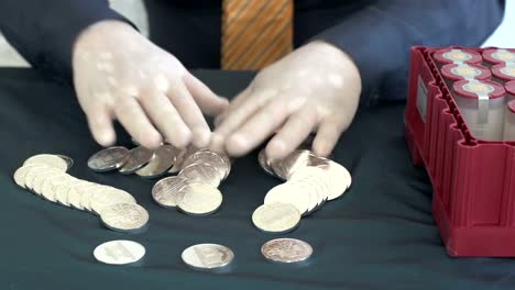 man-with-a-bunch-of-silver-coins