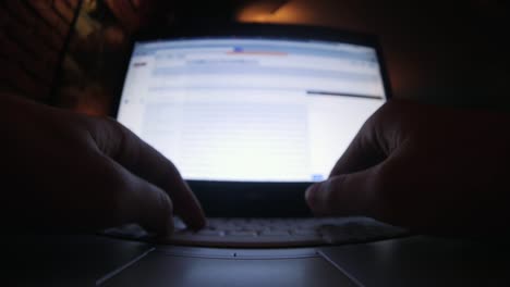 Typing-on-laptop-keyboard-close-up-wide-angle