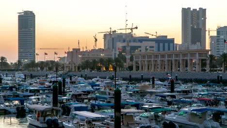 Yachts-and-boats-at-the-Sharq-Marina-night-to-day-timelapse-in-Kuwait.-Kuwait-City,-Middle-East