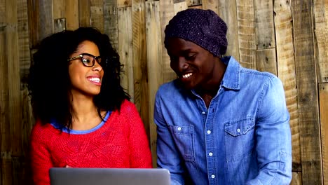 Couple-interacting-while-using-laptop