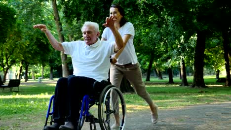 Granddaughter,-nurse,-caring-for-the-elderly,-girl-(woman),-grandfather,-happy,-freedom,-running-around-in-the-park.