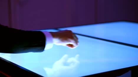 The-hands-working-with-a-touchscreen-display