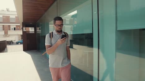 Man-walking-with-smartphone.