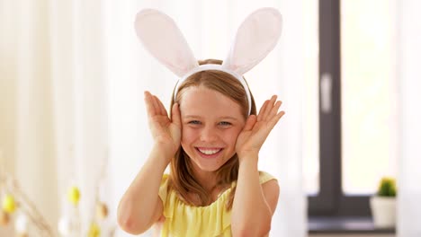 girl-in-easter-bunny-ears-playing-peek-a-boo-game