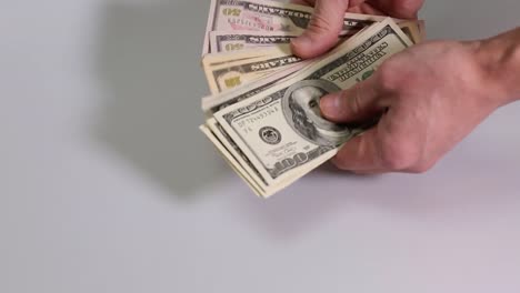 Short-film-showing-a-male-checking-bunch-of-dollar-bills.-Dollar-bill.-Finance-backgrounds.