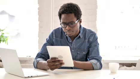 African-Man-Using-Tablet