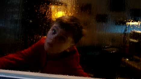 Wheelchaired-boy-watching-storm-from-room