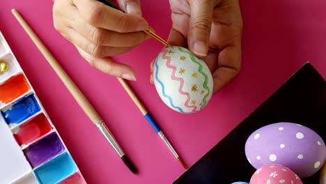 People-painting-colorful-Easter-eggs