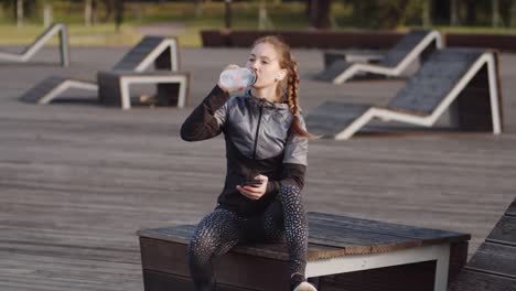 Sportswoman-Resting-in-Park