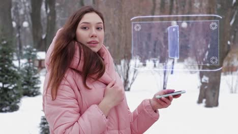 Red-haired-girl-with-hologram-modern-smartphone