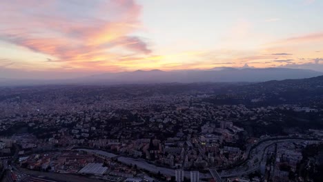 Nice-France-city-nightligts-drone-sunset-roze-sea