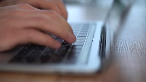 Hands-typing-on-computer-keyboard,-close-up