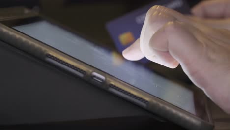 4K-Video-credit-card--touch-on-tablet-screen.