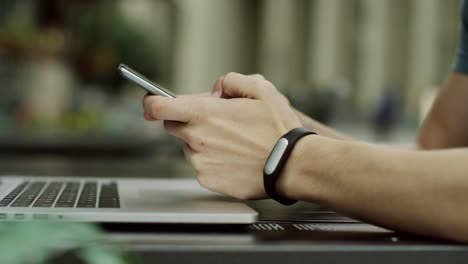 Man-working-with-smartphone-and-tablet-computer