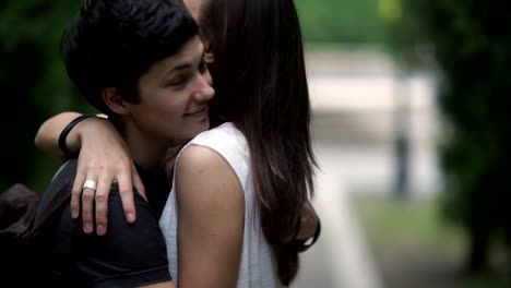 Two-lesbians-hugging-in-the-park