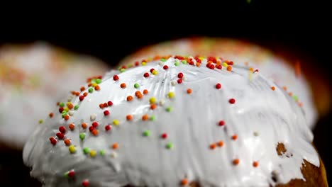 Falling-round-colorful-sprinkles-onto-Easter-cake