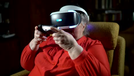 70-year-old-woman-playing-video-game-uses-VR-headset-and-gaming-controller